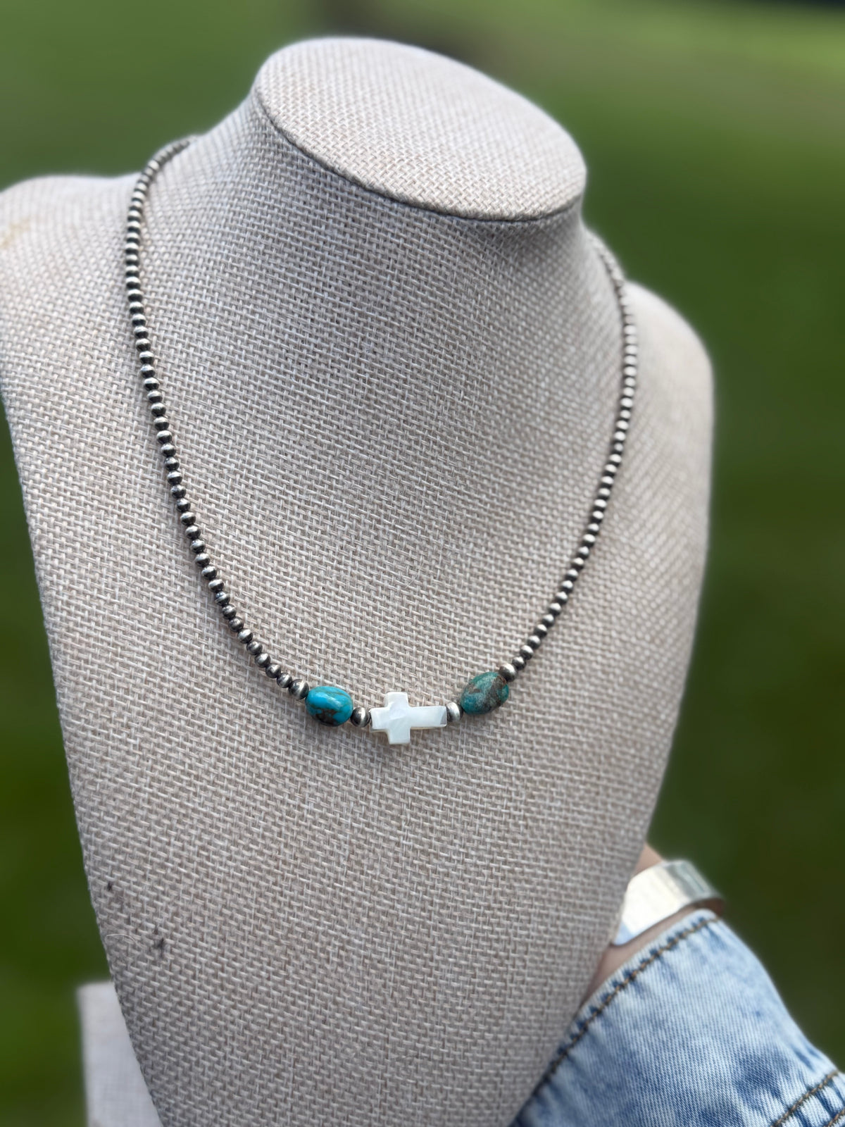 The pearly cross necklace