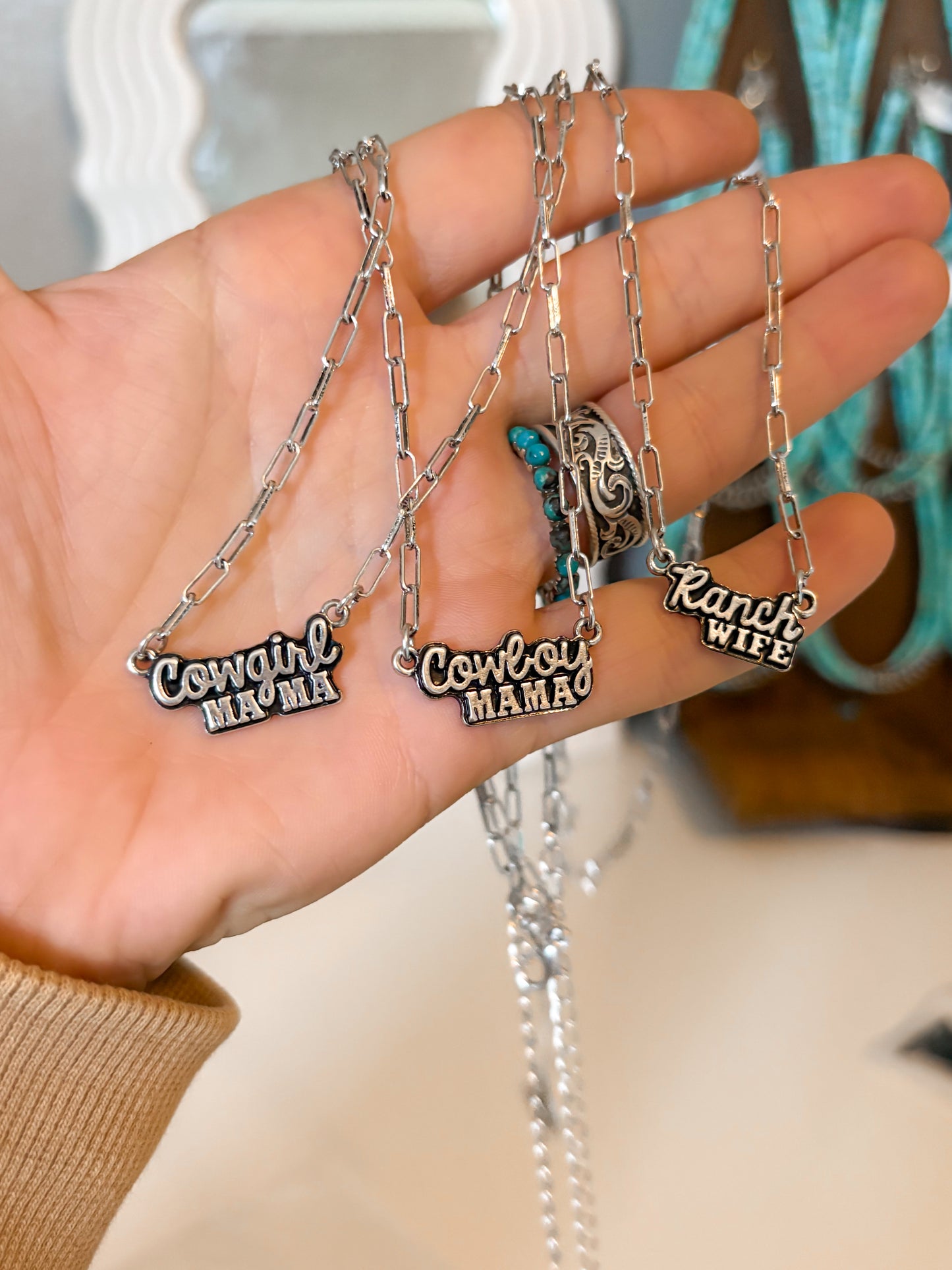Western title necklaces