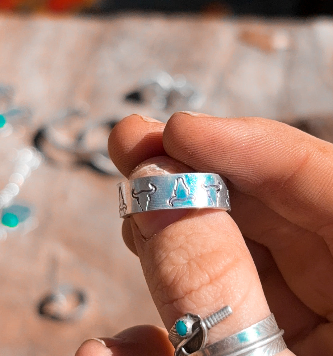 The groovy steer head stamped ring