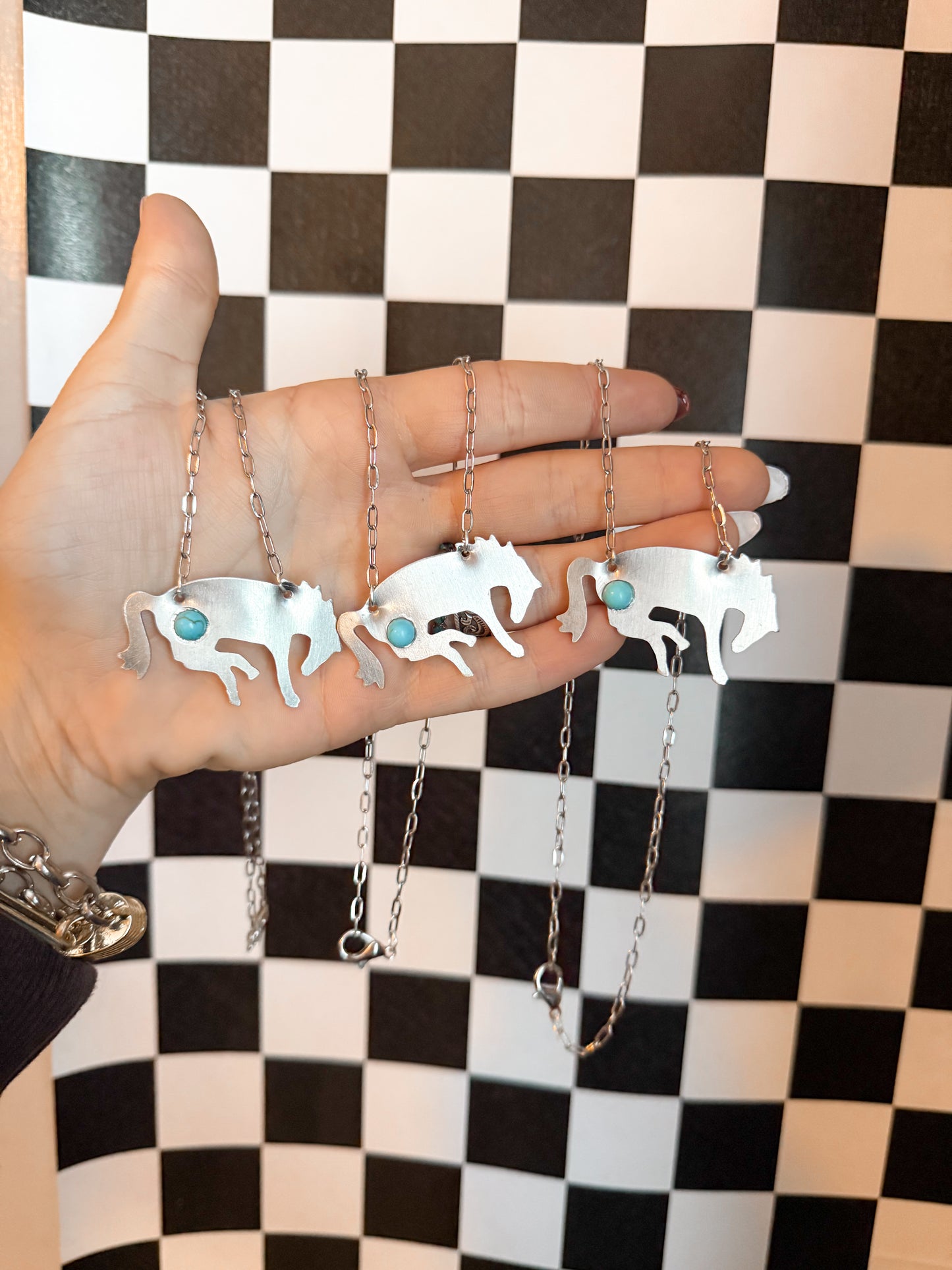 The OG bucking horse necklaces