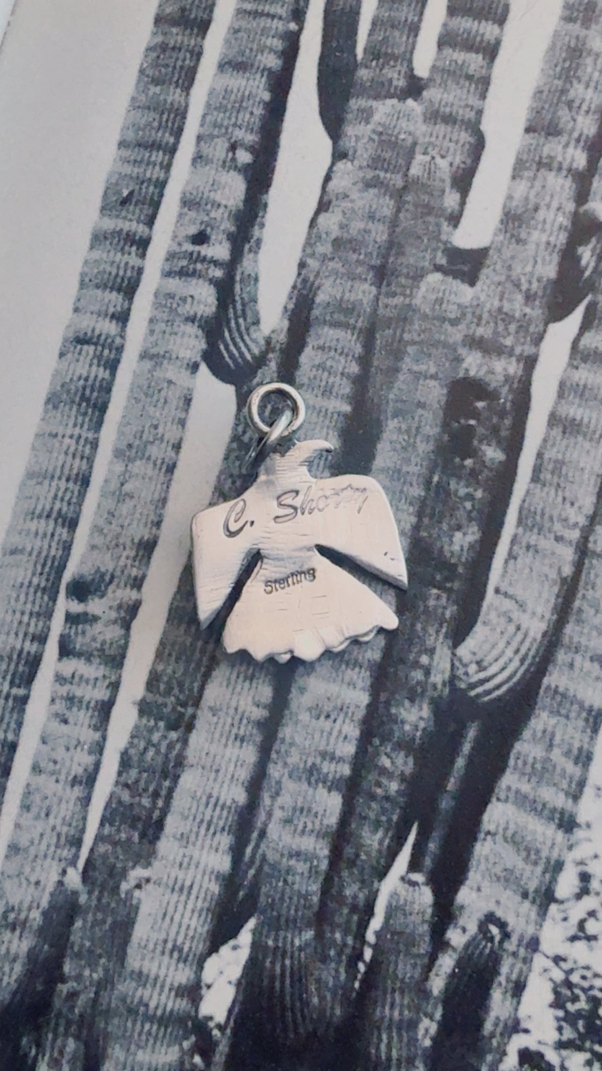 Pink conch Thunderbird pendant