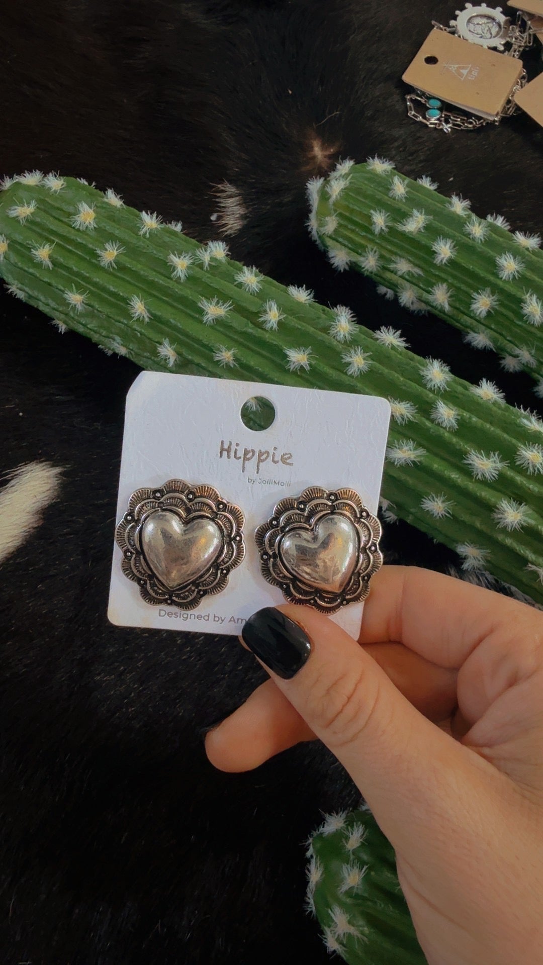The silver heart stud earrings