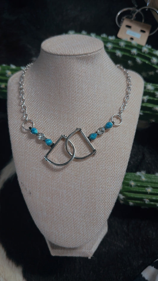 Interlocking snaffle necklace