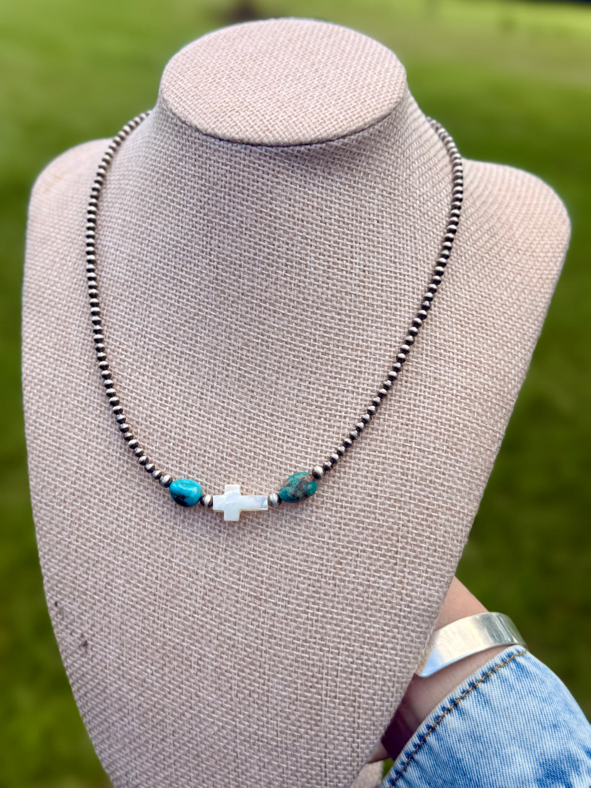 The pearly cross necklace