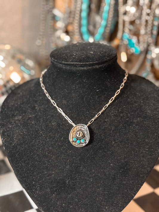 The cowboy hat necklace