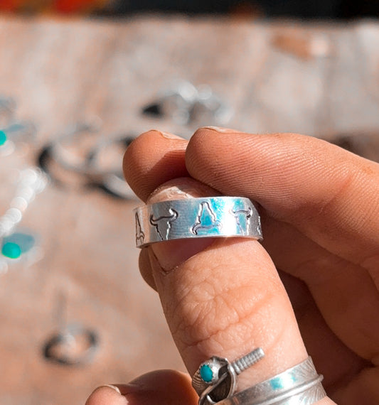 The groovy steer head stamped ring