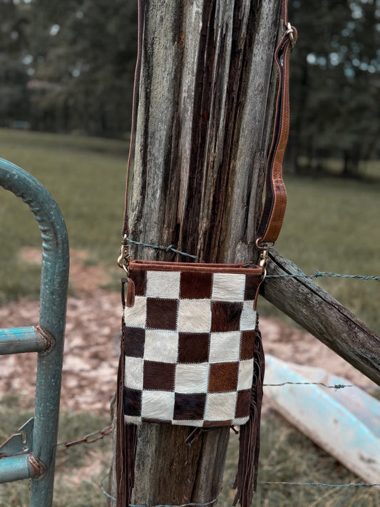 The small checkered cowhide fringe purse