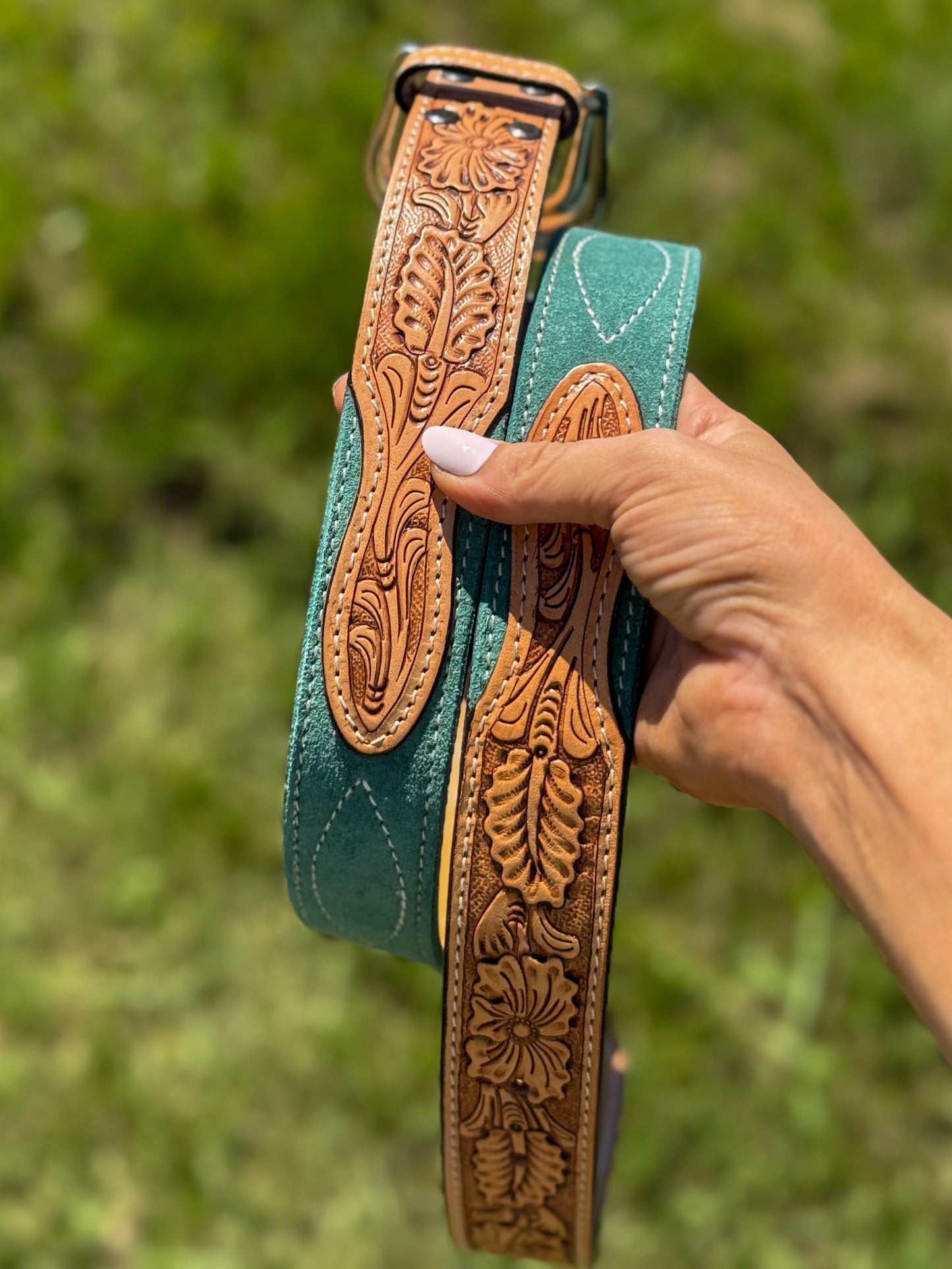 The turquoise tooled leather and rough out belt