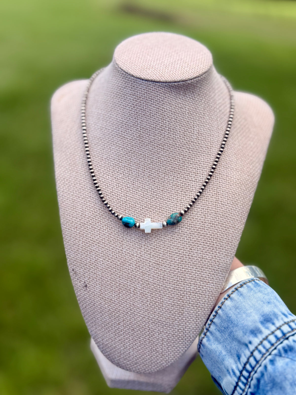 The pearly cross necklace