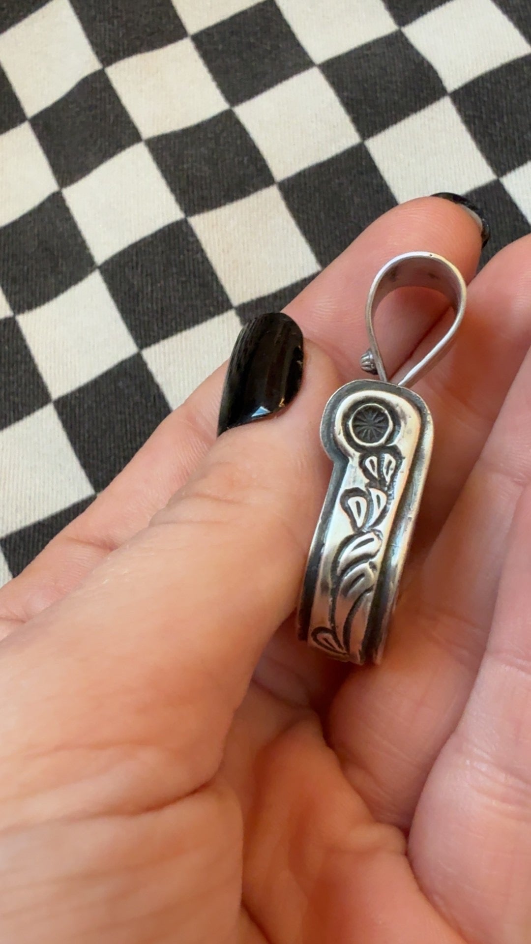 The cowgirl stirrup pendant
