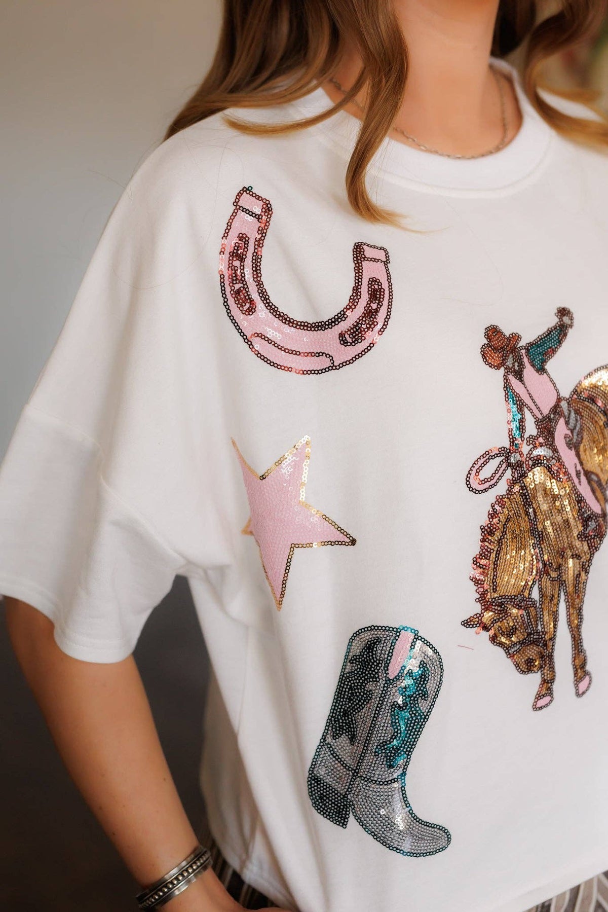 Dolman Bucking Horse Sequin top